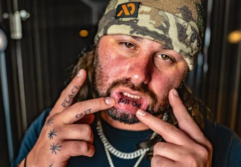 Koe Wetzel cranks up release week with a new lip tattoo