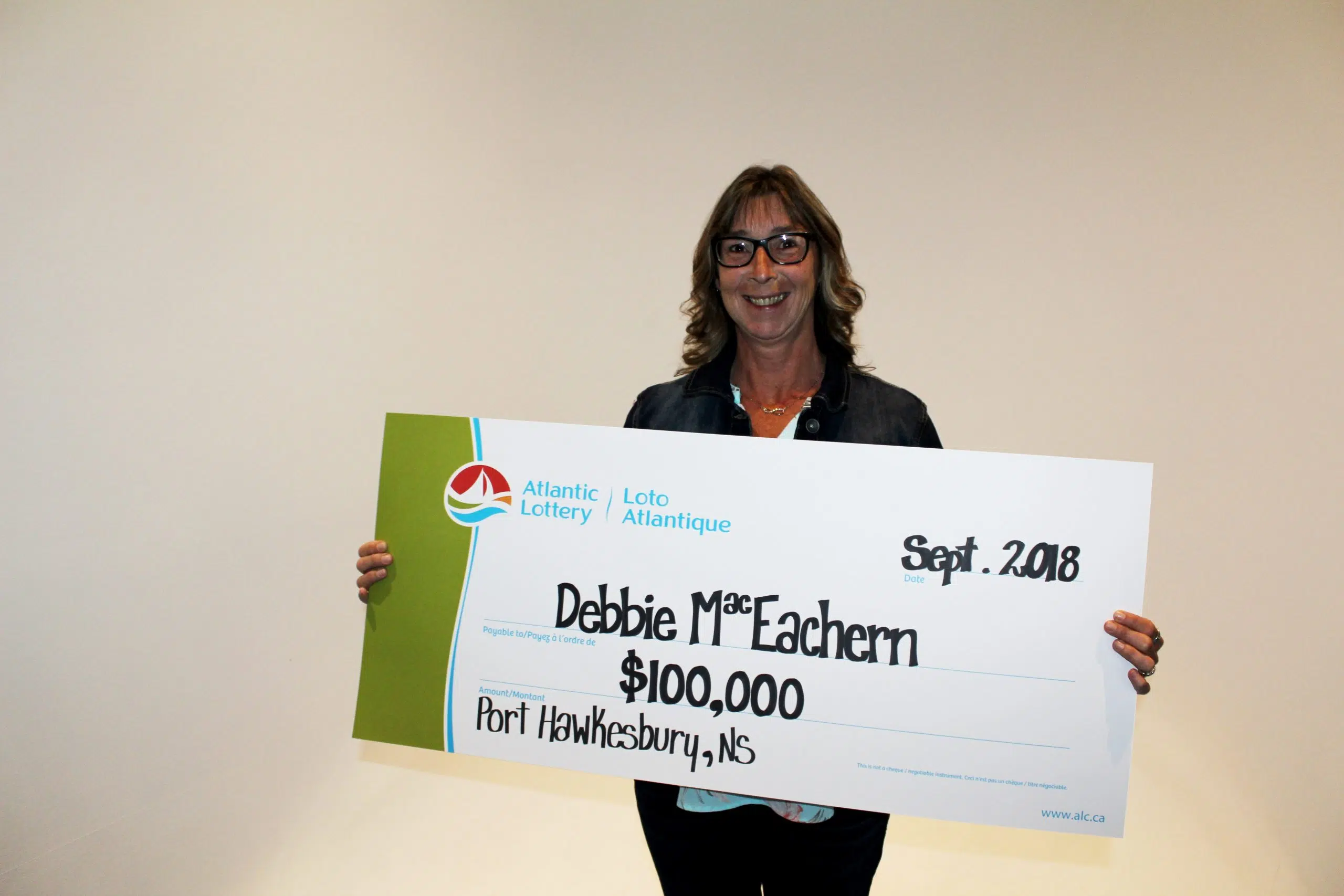 Local lotto winner claims prize