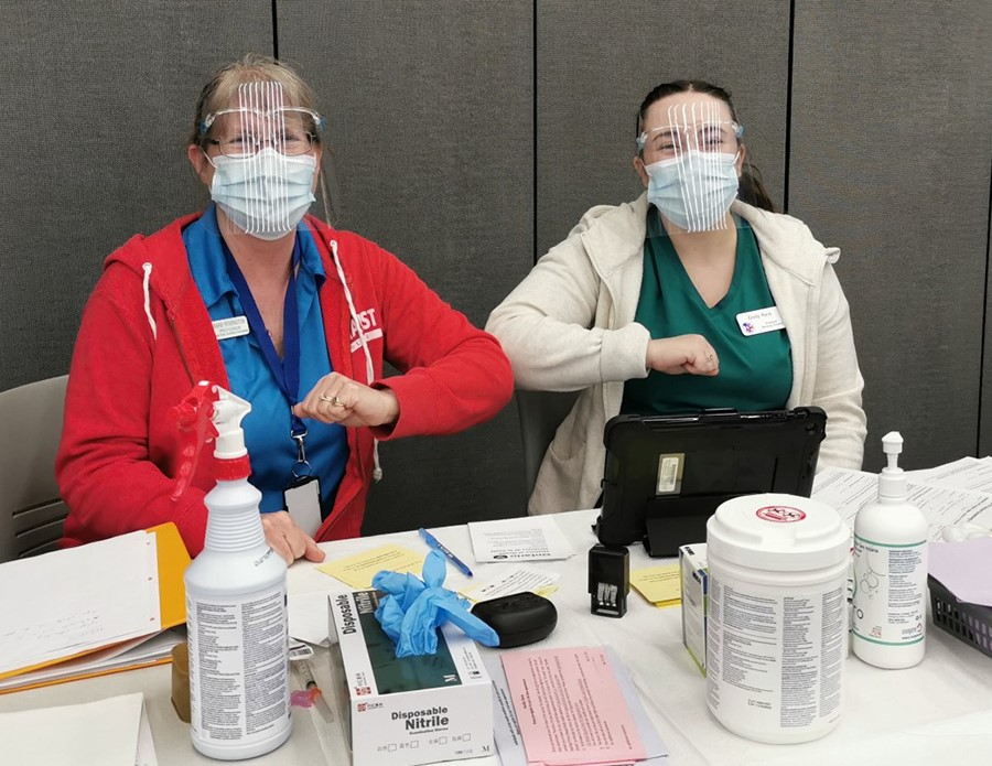 Loyalist College students helping to administer COVID-19 vaccines at the clinic on campus