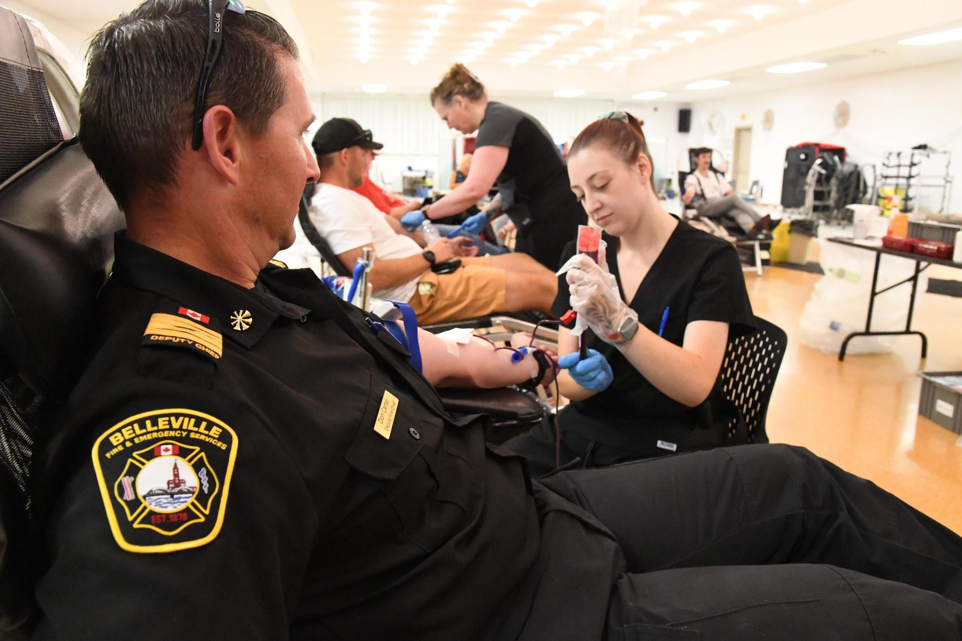Belleville firefighters and police officers supporting Canadian Blood Services