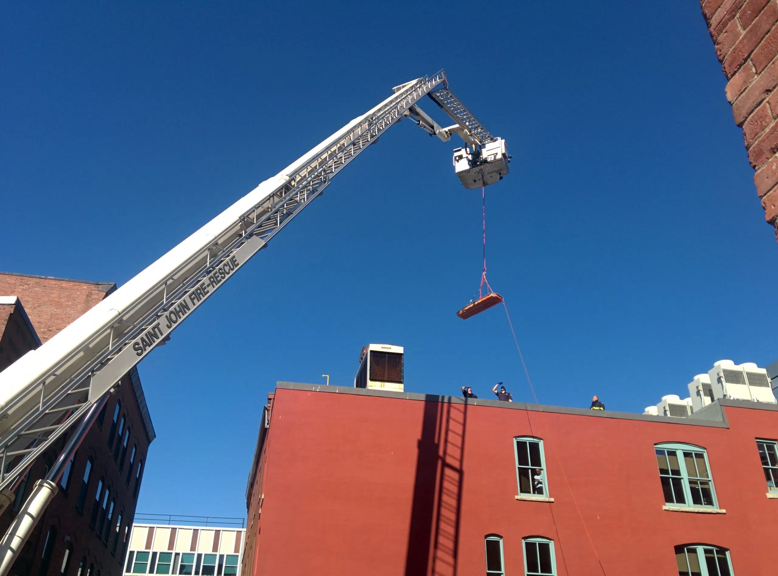 Emergency Crews Rescue Man From CenterBeam Place Roof