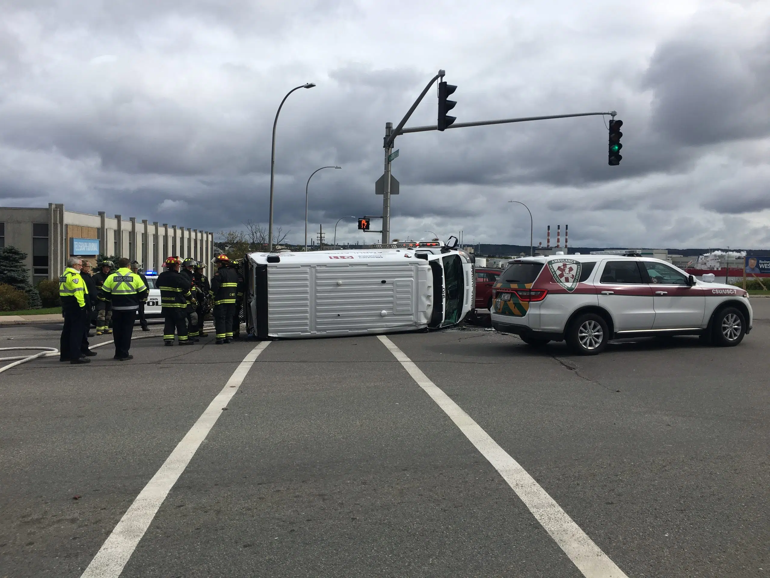 Ambulance Rolls Onto Its Side In Crash