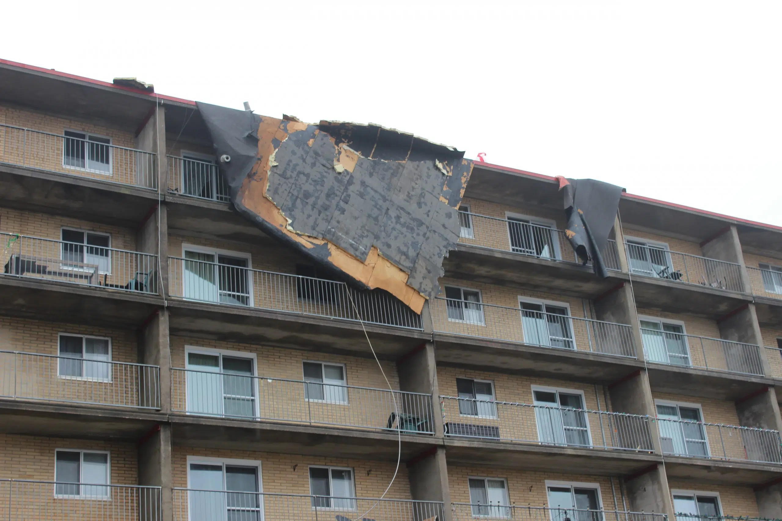 UPDATE: Two Buildings Evacuated After High Winds Damage Roofs