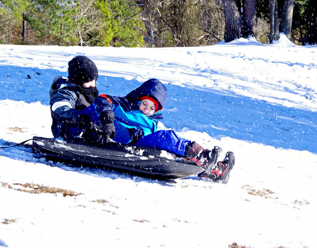 Going sliding with friends playing outside till the daylight ends