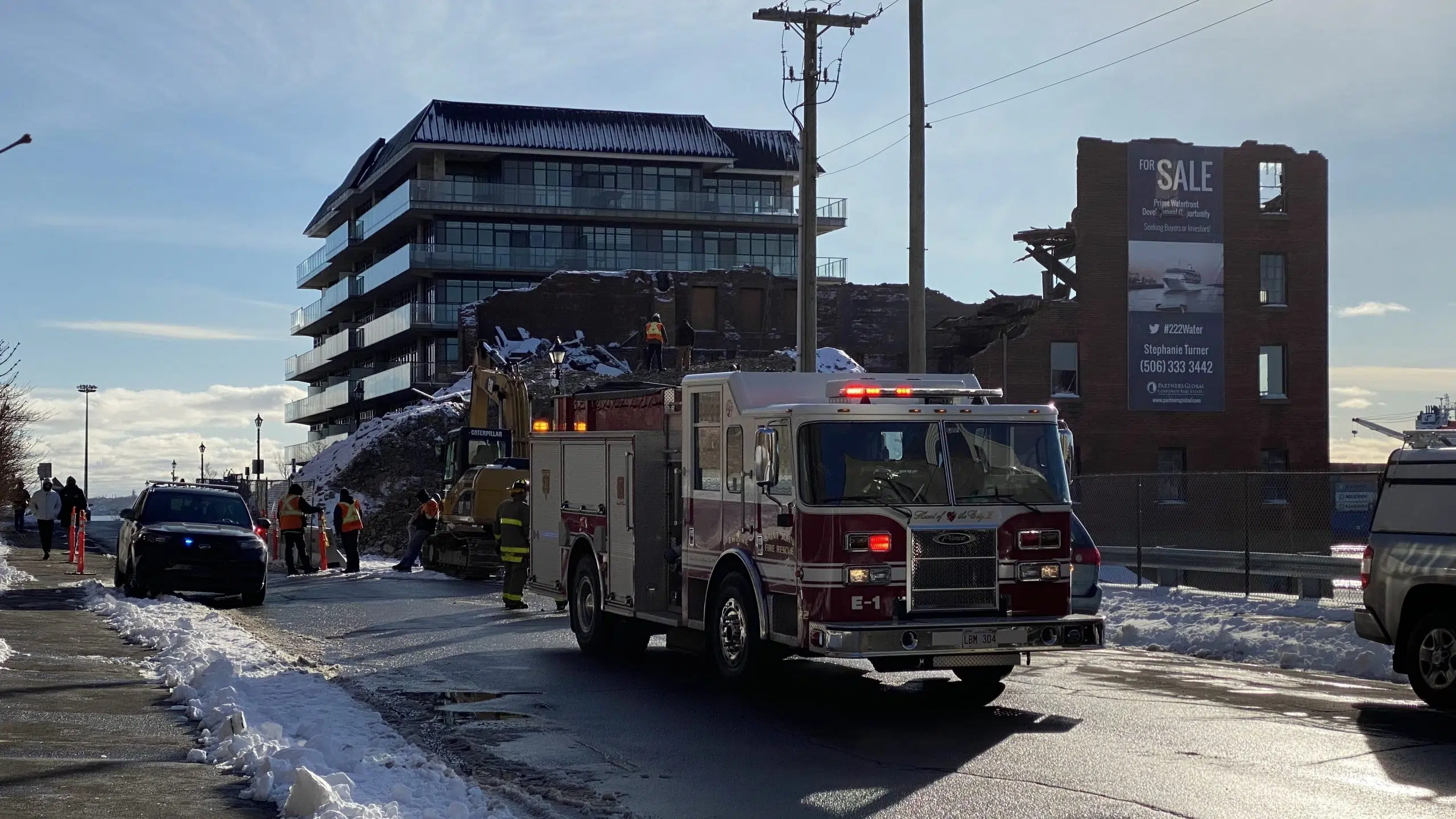 VIDEO: Excavator Falls Through Uptown Building