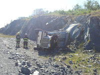 Driver of Overturned Dump Truck Hospitalized