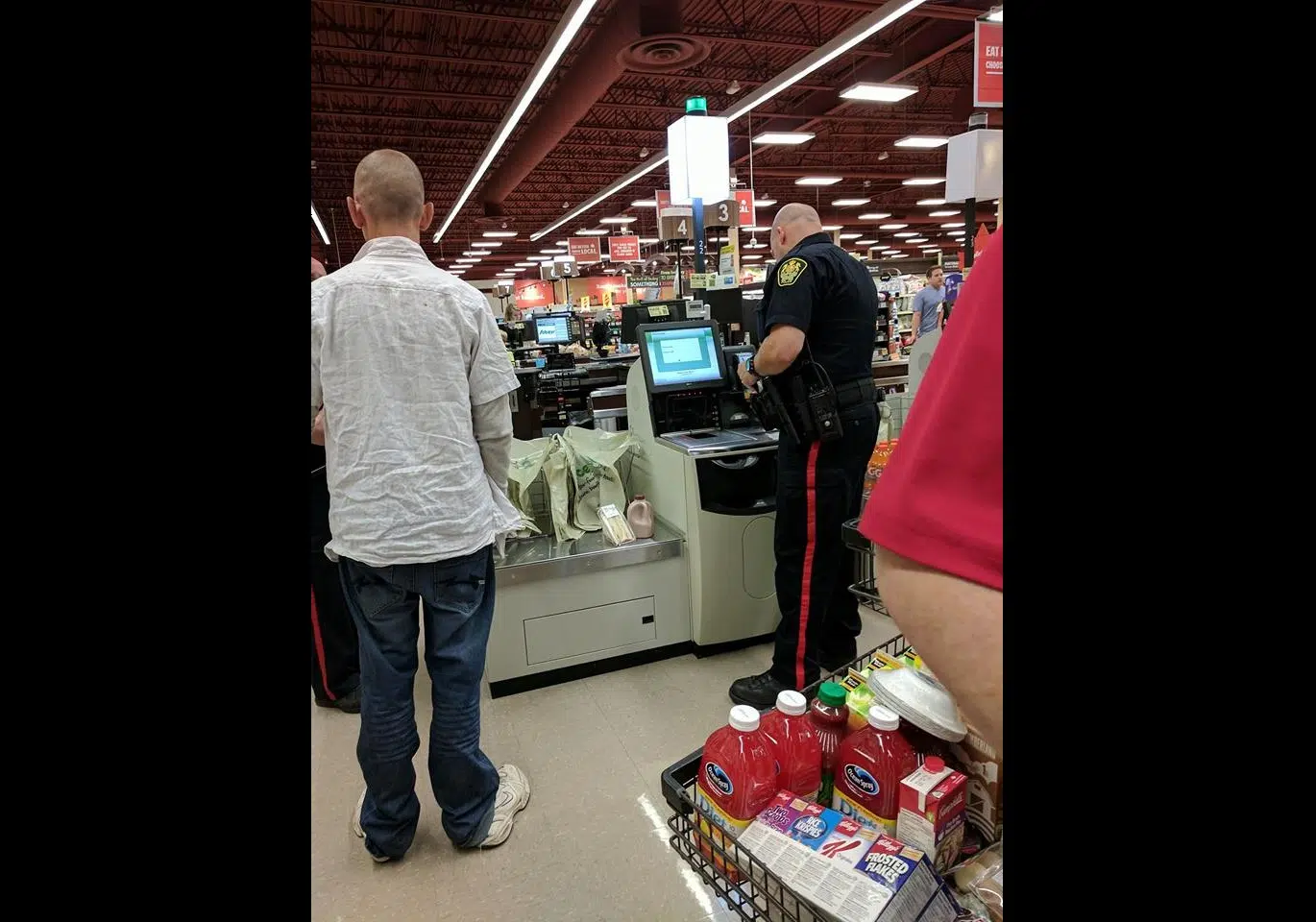 Saint John Police Officer's Act Of Kindness Captured In Photo