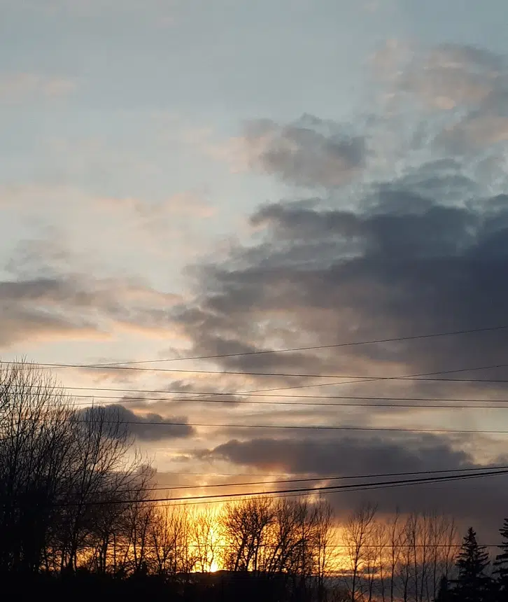 Sunset Through Dark Clouds