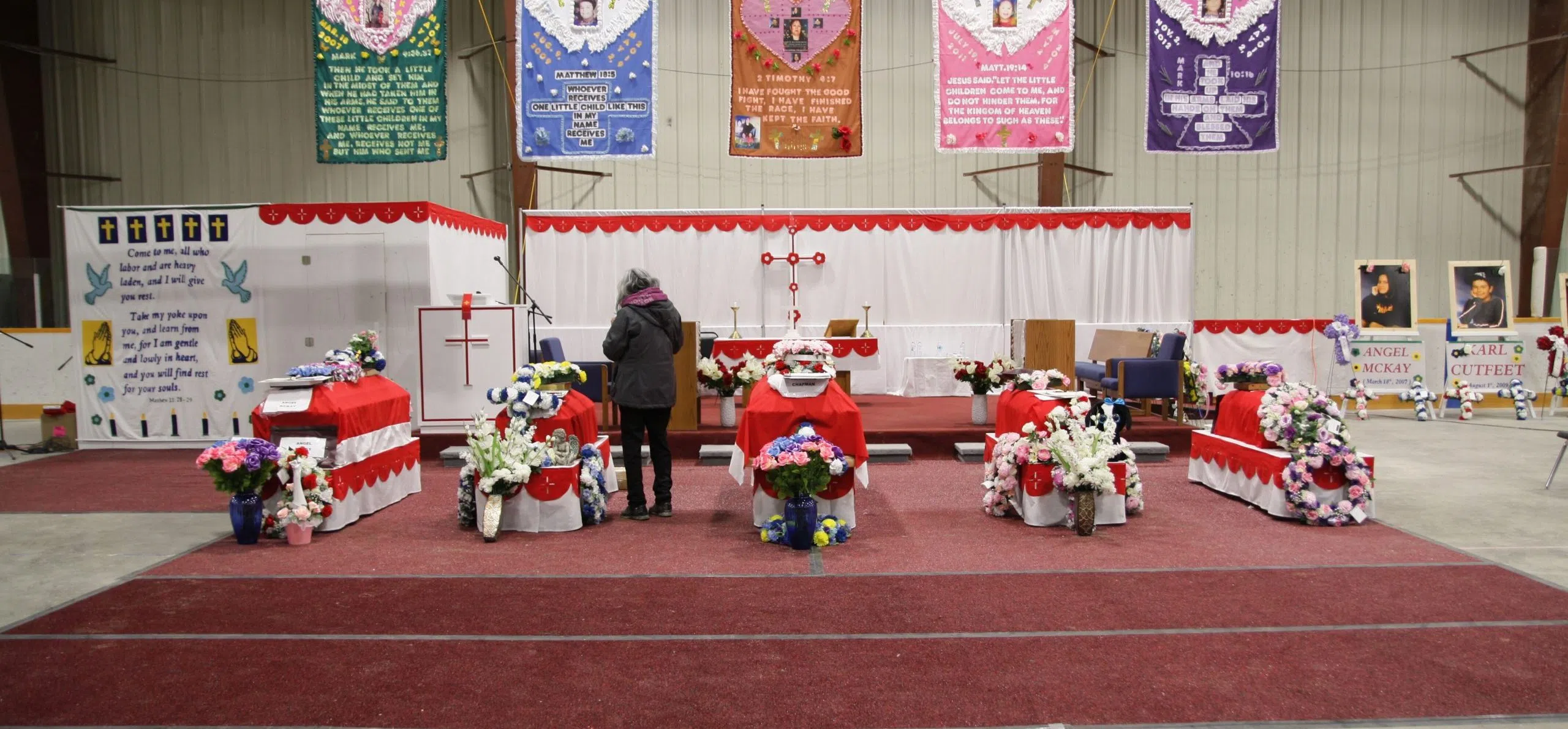 Community Bears Grief At Funeral 