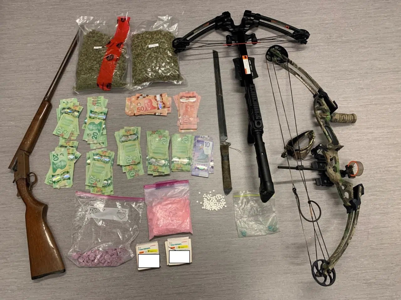 Gun, Weapons, Drugs, Cash Seized In Fort Frances