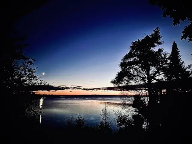 The Moon At Sunset Over Wabigoon Lake