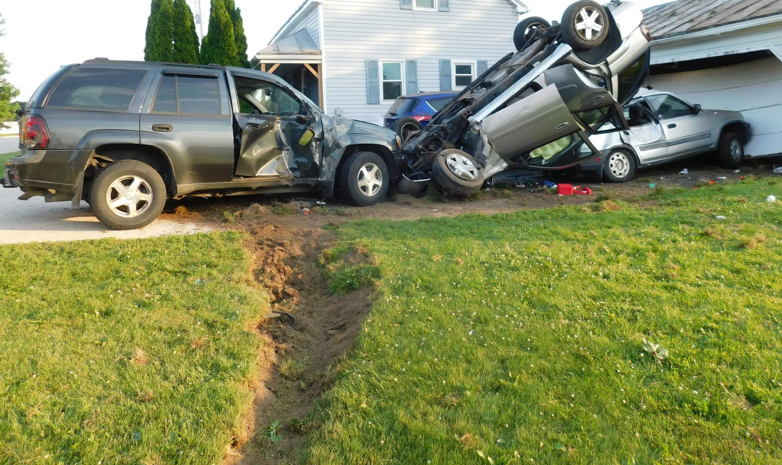 5 Vehicles and a Garage Damaged During Tuesday Evening Rollover Crash