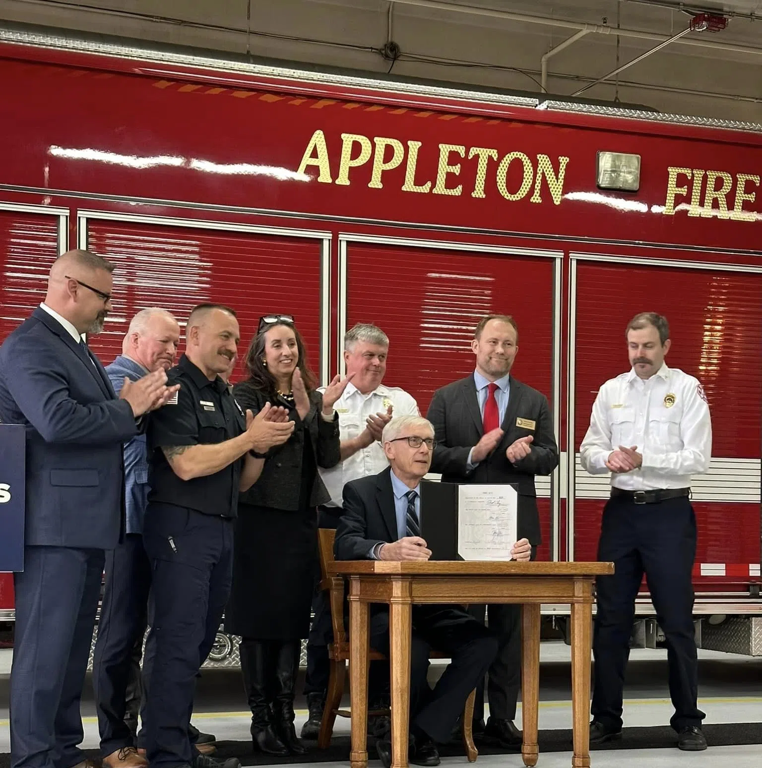 Evers Signs TEMS Bill in Appleton