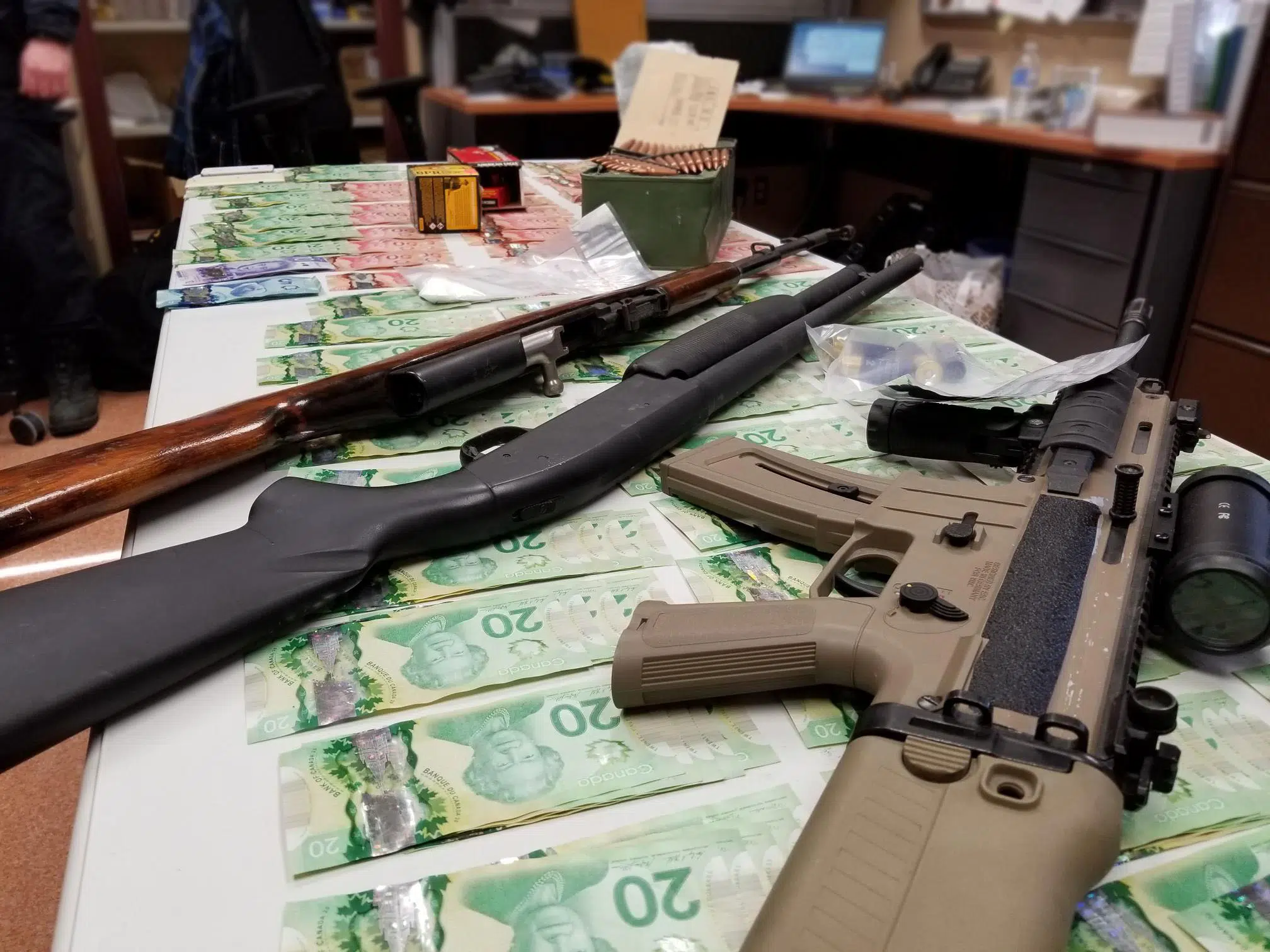 Guns, drugs and cash seized in joint law enforcement investigation