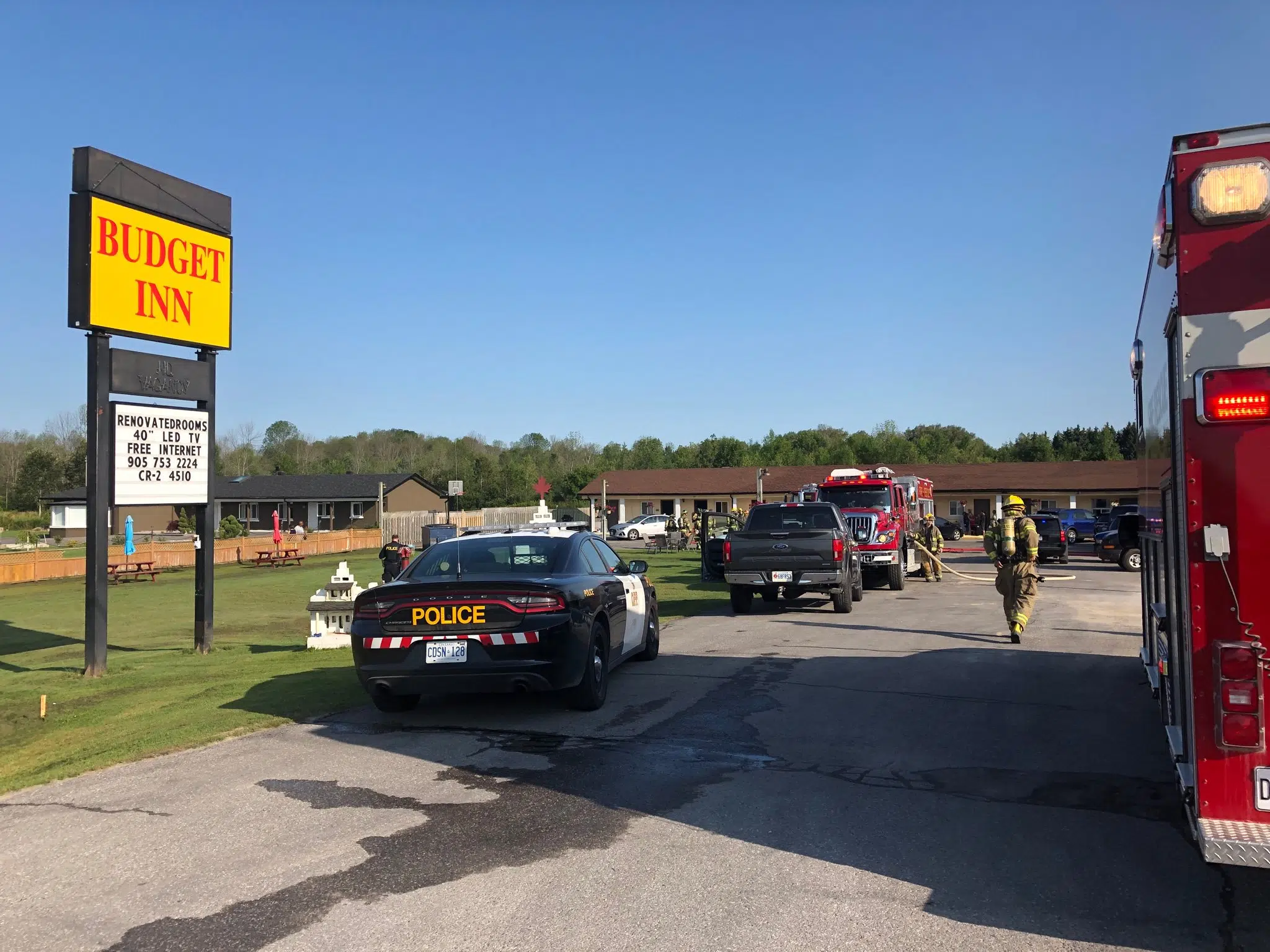 One man in custody following motel fire, flees from police