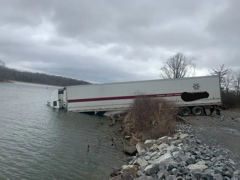 Transport leaves highway and ends up in river