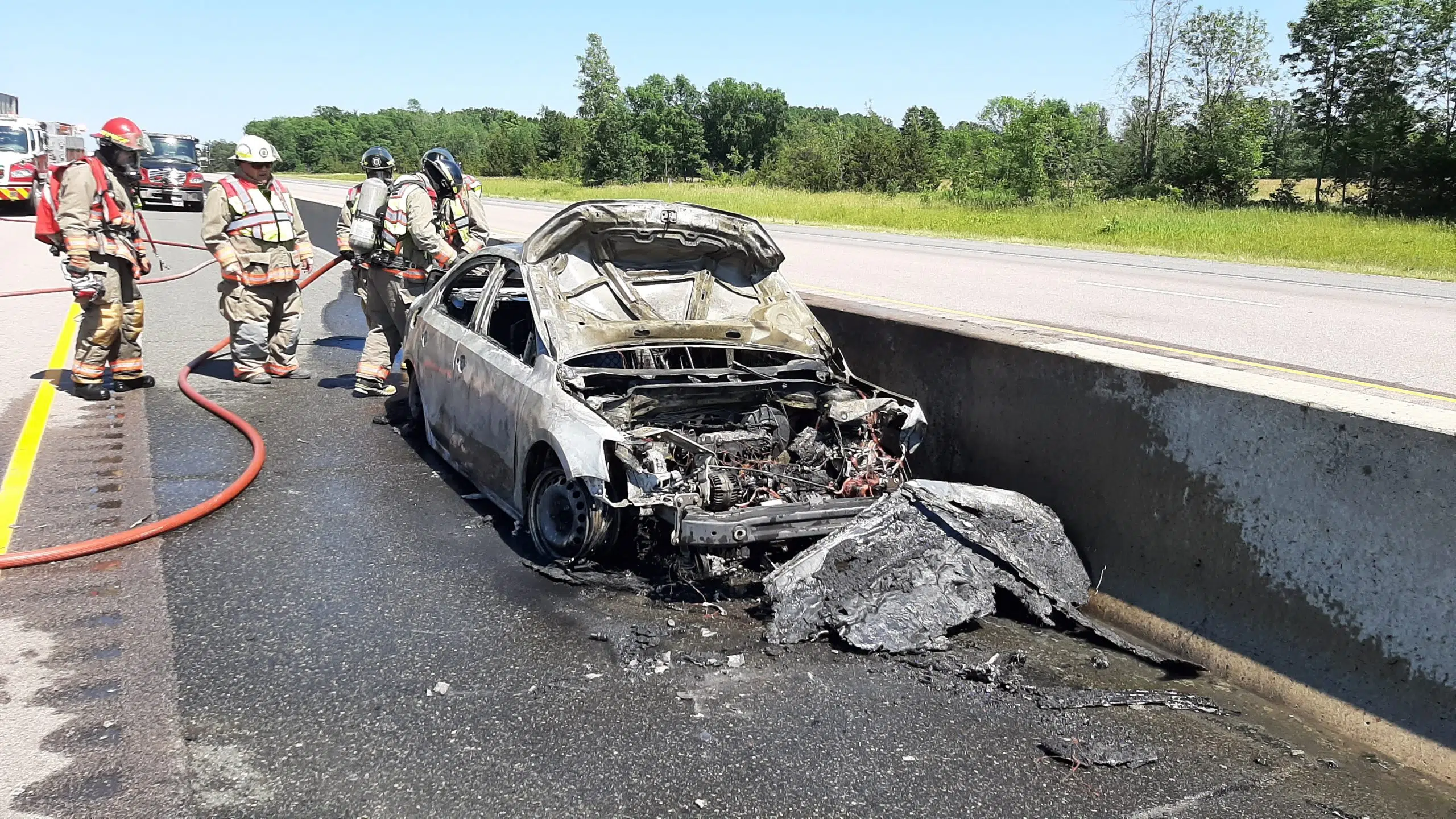 Charges laid following 401 car fire