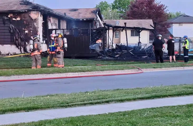 Flames scorch backyard and house