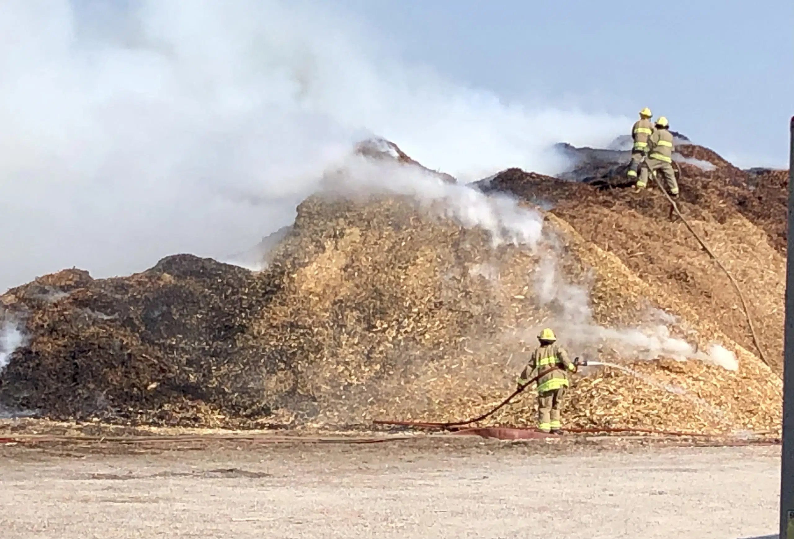 Giant piles of mulch on fire on west side of Quinte West