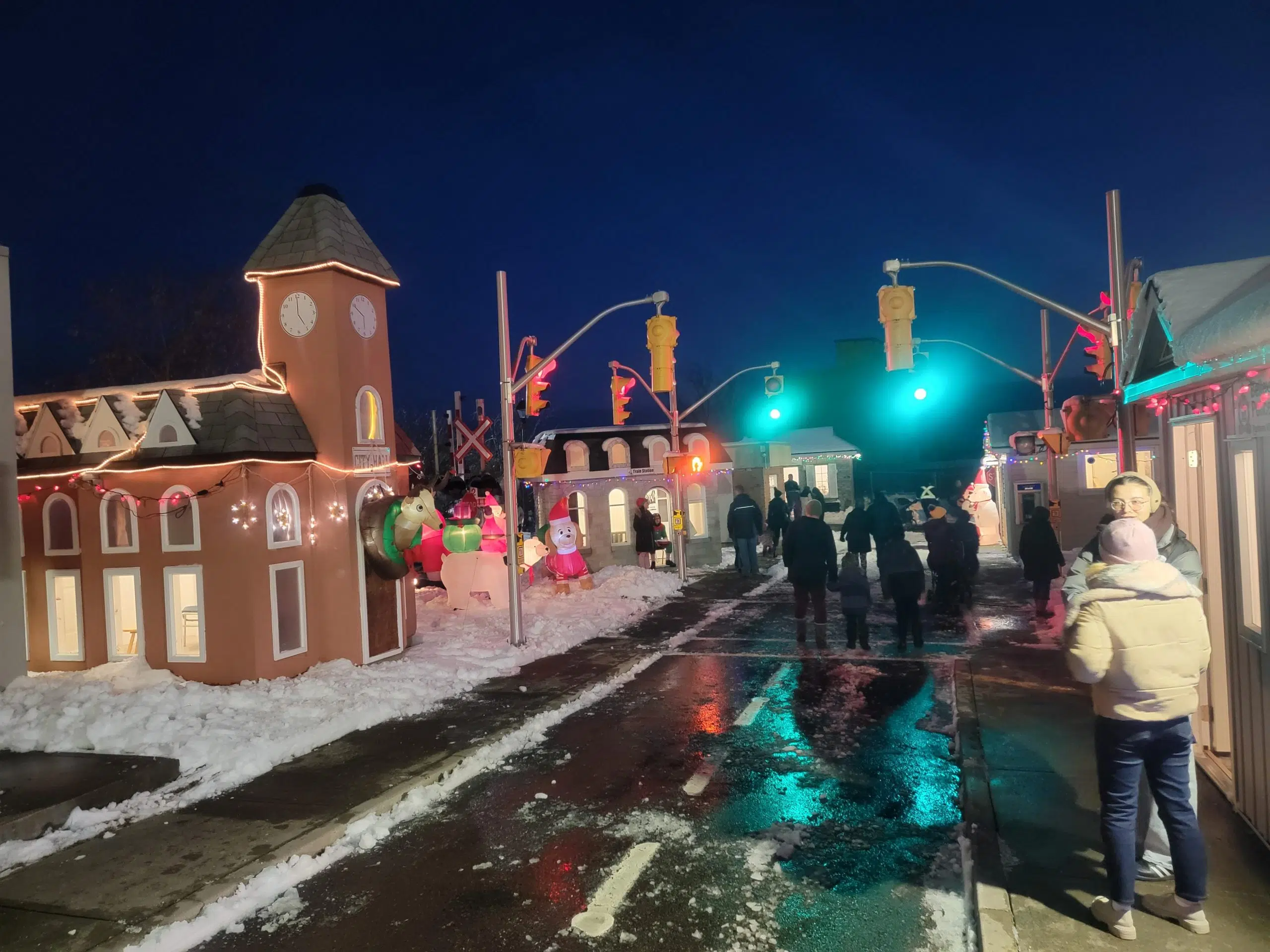 Delayed a day, hundreds still attend Christmas in the Village