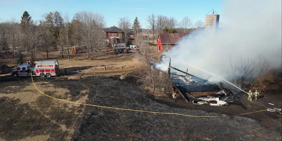 Barn destroyed by fire, one person injured