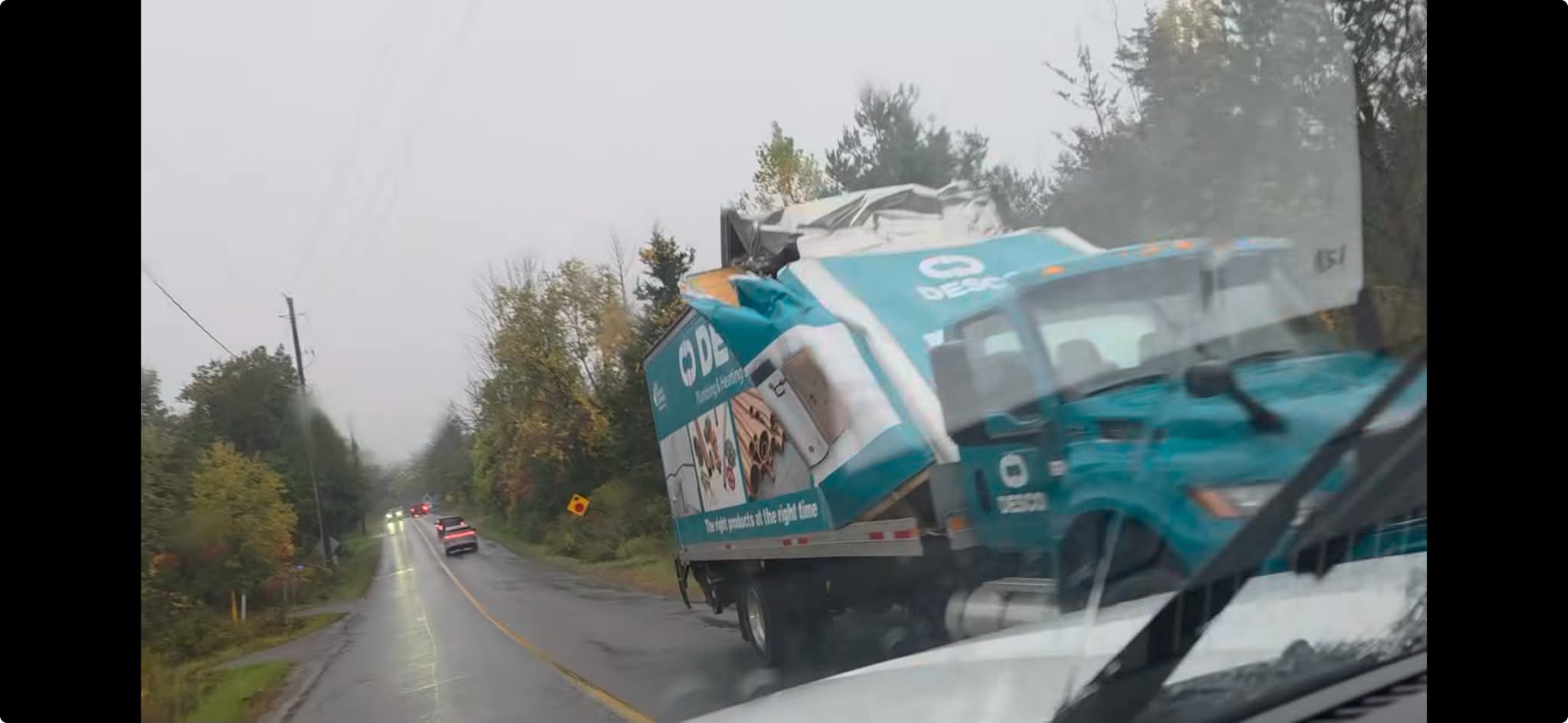 Truck strikes train bridge