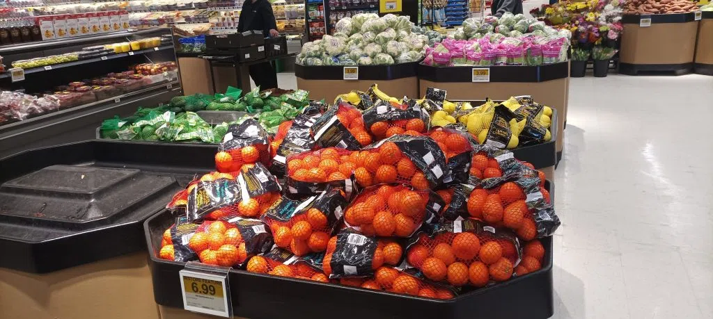 photo of oranges and other produce at a grocery store