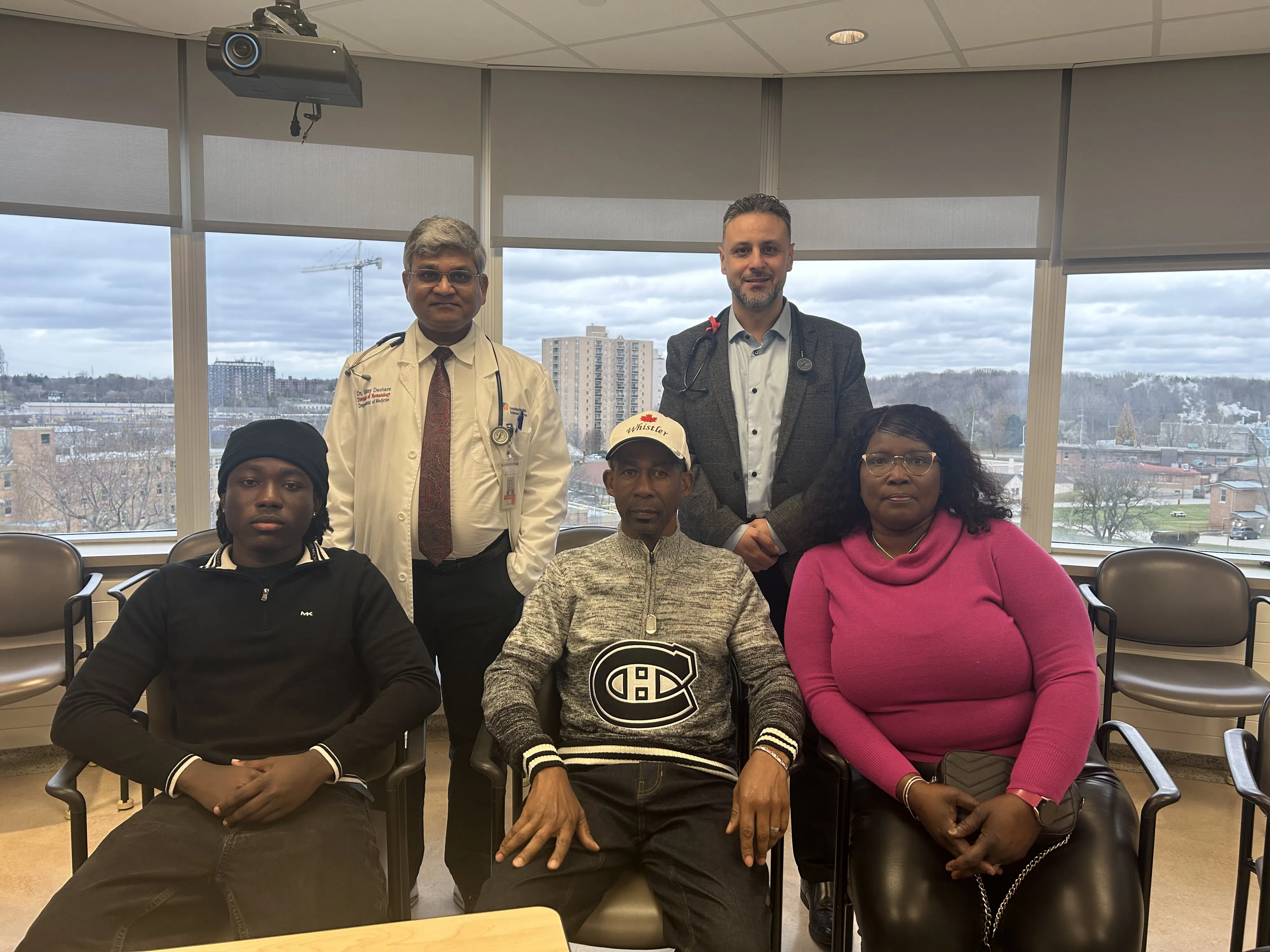 The Halstead family with doctors behind them.