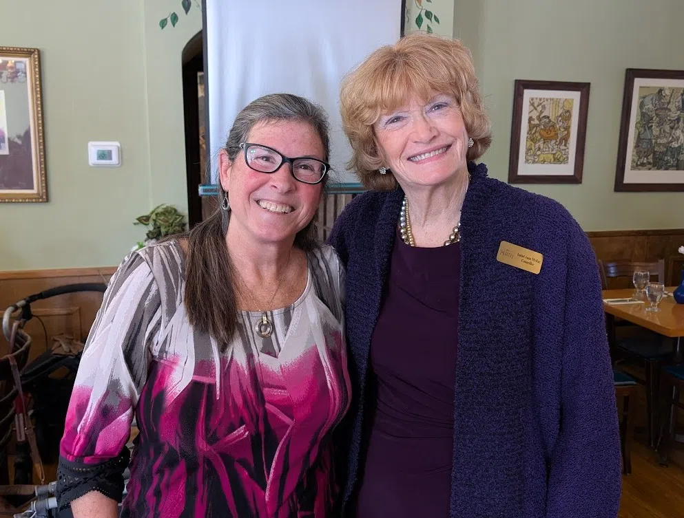 Isabel Anne McRae is seen with Canadian legendary marathon swimmer Vicki Keith