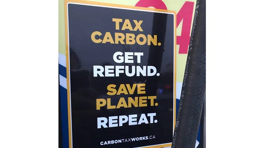 PRO-CARBON TAX STICKERS APPEARING ON LOCAL GAS PUMPS