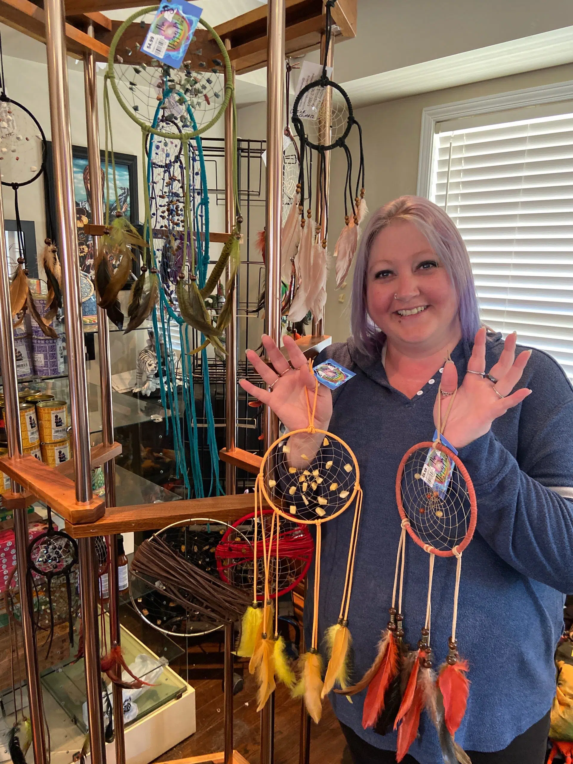 Local business owner creates dream catchers by feel and memories of her childhood.