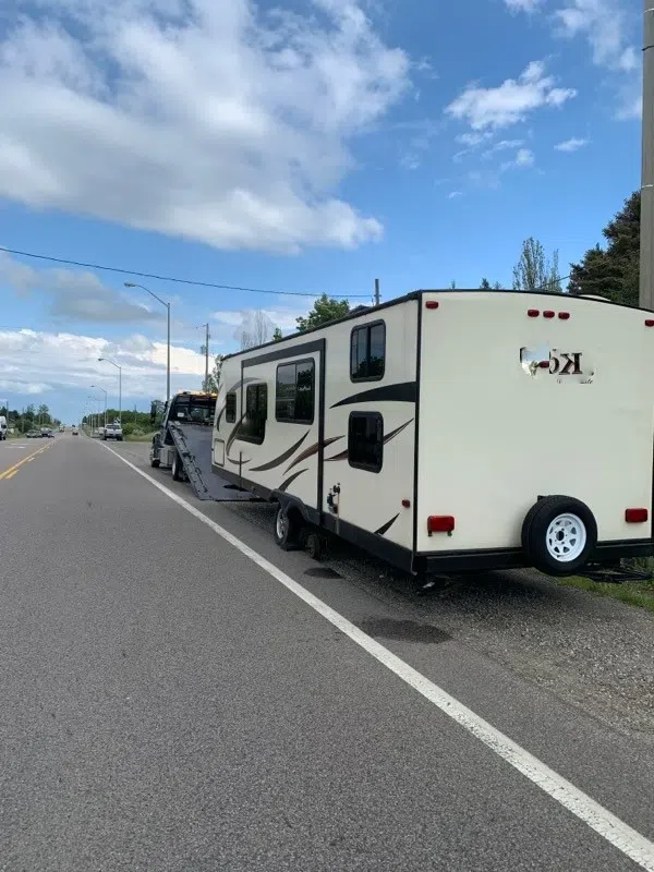 RV driver receives multiple charges after tire dislodges and strikes two vehicles