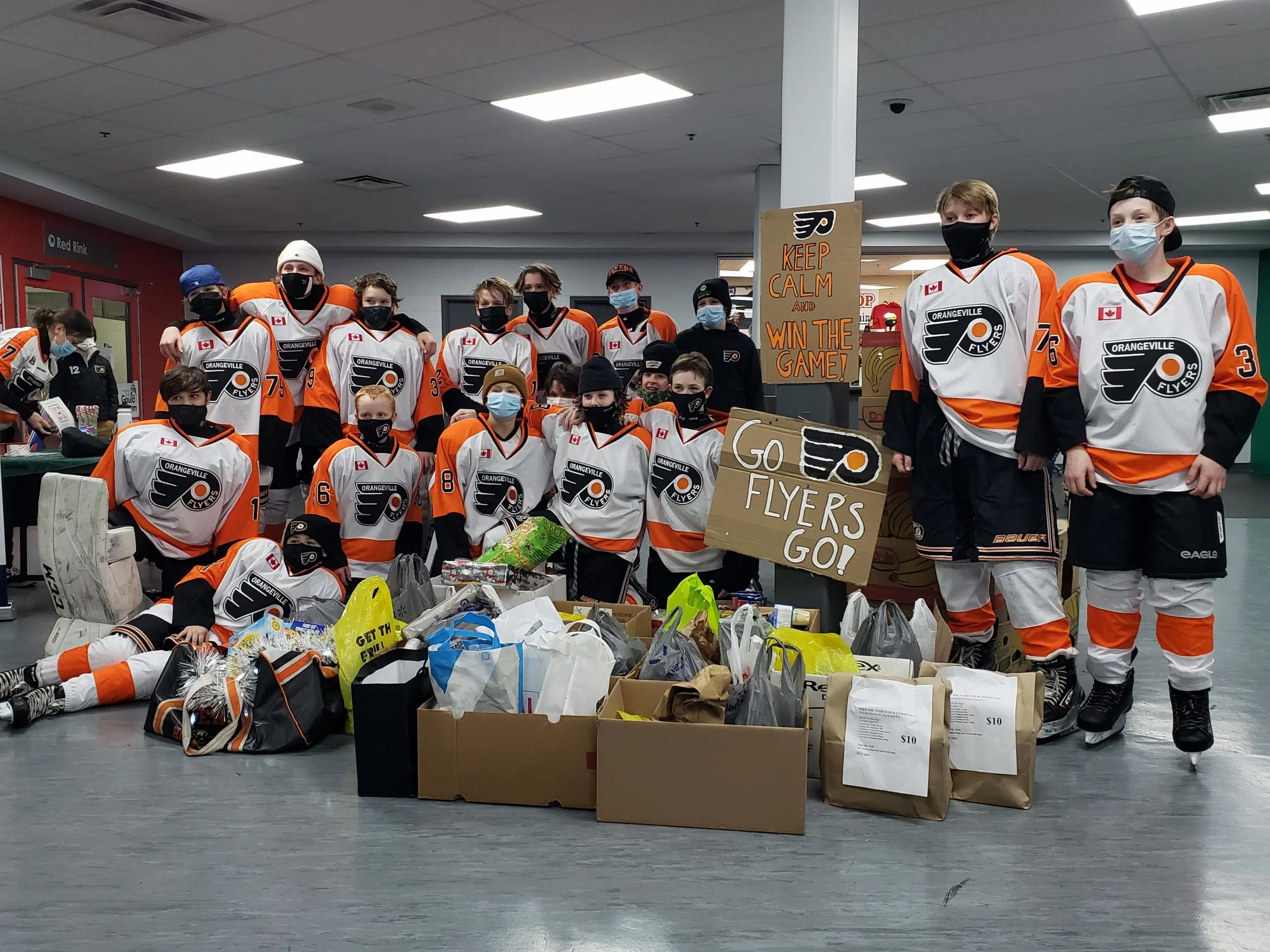 Orangeville Flyers U13 AA Team donates to the Orangeville Food Bank