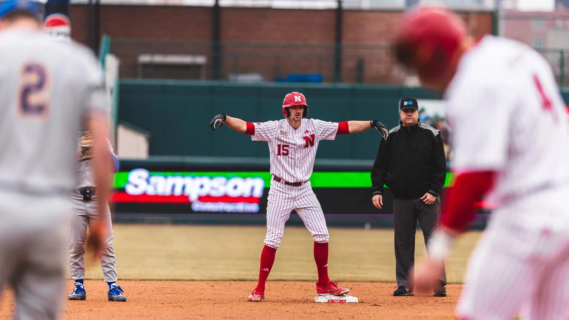 Carey Leads Huskers to 5-4 Win