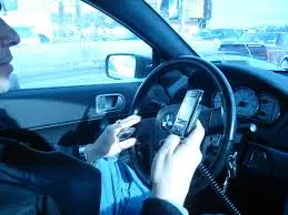 House bill to ban hand-held cell phones while driving narrowly clears 1st legislative hurdle