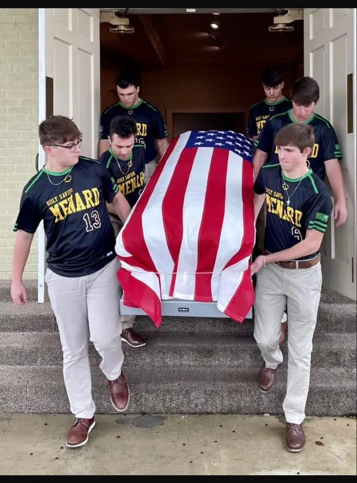 Menard baseball players help a 94-year old military veteran receive his honors at his funeral