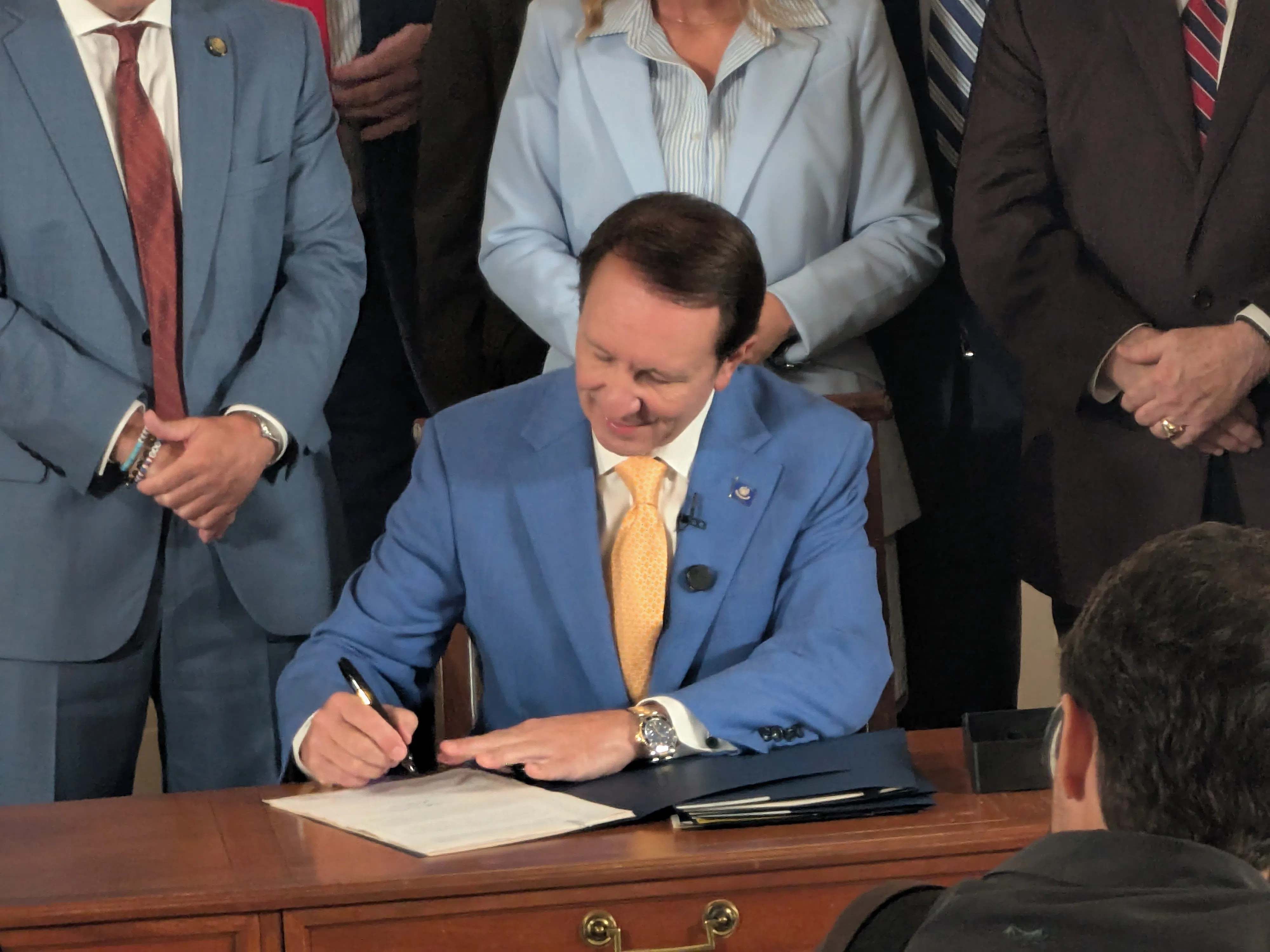 Landry signs six auto insurance reform bills in ceremony in governor's mansion