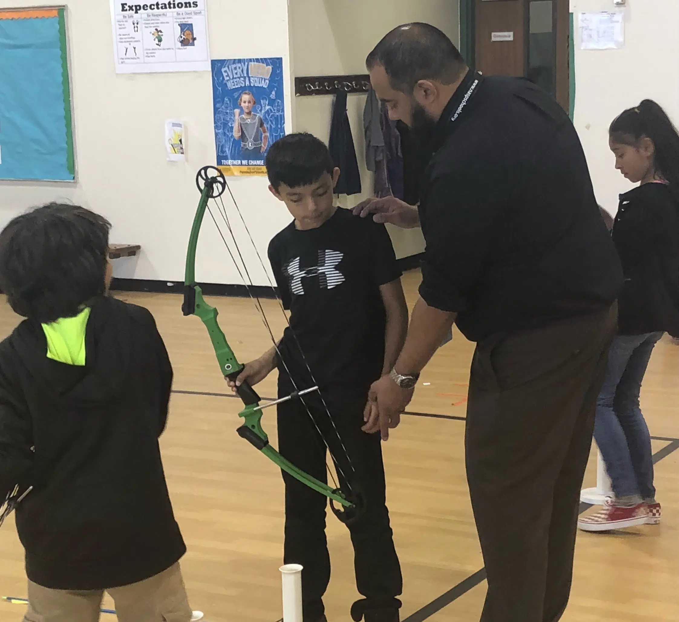 Patlan students aiming for the bullseye during state archery competition 