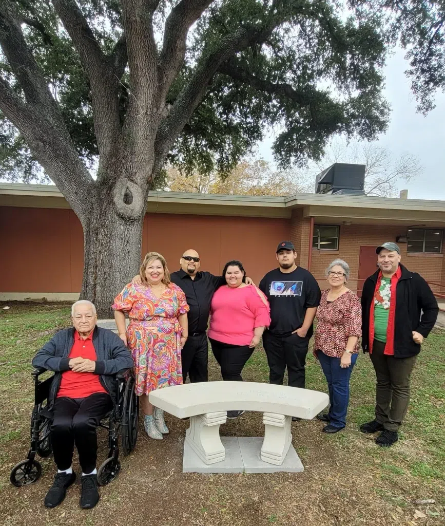 Former school employee recognized by family