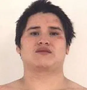 Local man arrested after spitting on, kicking officers