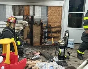 Sleeping homeowner alerted by neighbor of fire