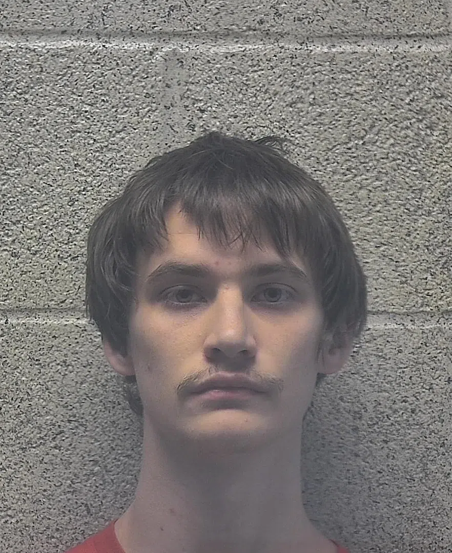 Man arrested in connection with shots fired at apartment building