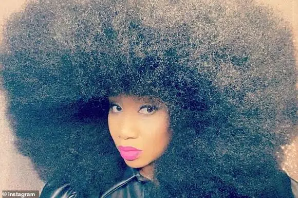 Louisiana woman sets record for world's largest AFRO, with her hairstyle having a 5'5" circumference