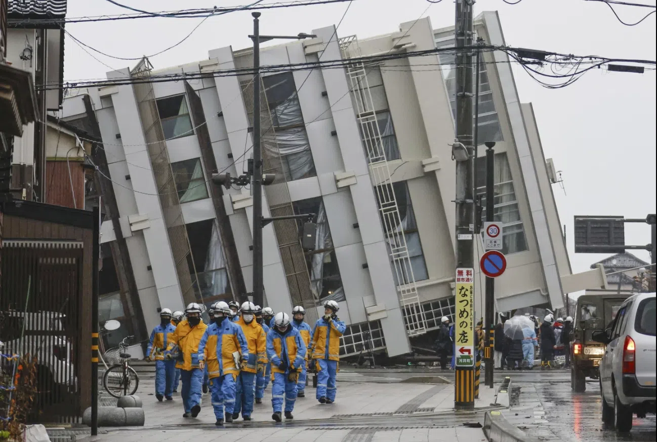 Rescuers race against time in search for survivors in Japan after powerful quakes leave 73 dead