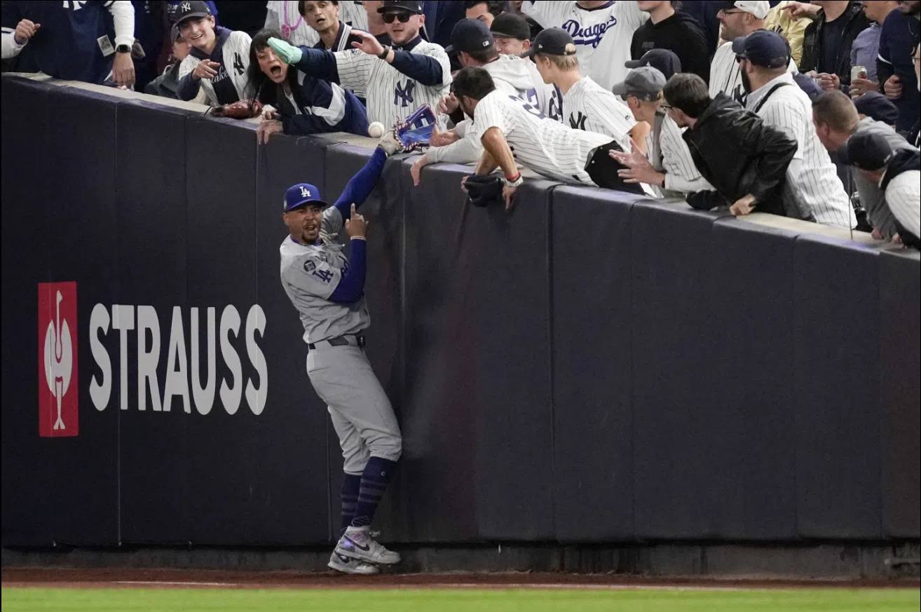 Yankee Stadium fans ejected after one pries ball out of Mookie Betts' glove at World Series