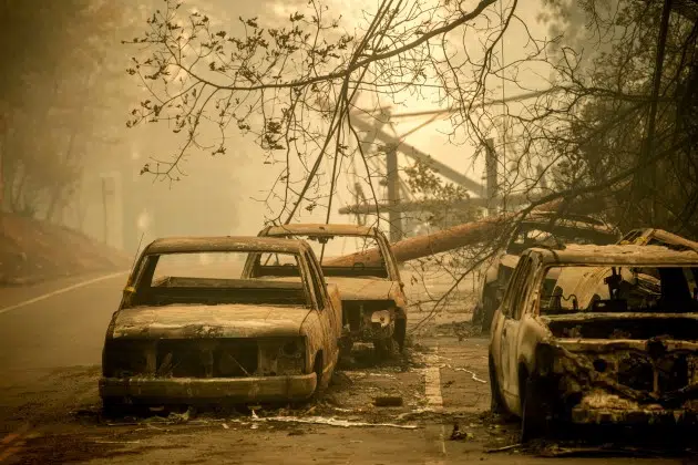 FILE - Abandoned cars, scorched by the wildfire, line Pearson Rd. in Paradise, Calif., on Saturday, Nov. 10, 2018. Currently, the Maui wildfires are the nation's fifth-deadliest on record, according to research by the National Fire Protection Association, a nonprofit that publishes fire codes and standards used in the U.S. and around the world. The Camp Fire killed 85 people and forced tens of thousands of others to flee their homes as flames destroyed 19,000 buildings in Northern California.