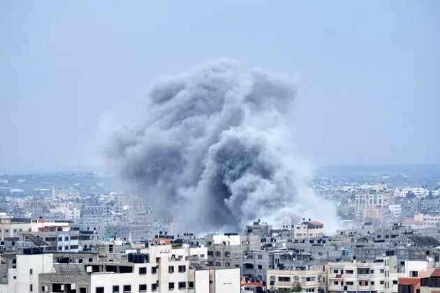 Smoke from an Israeli airstrike rises in Gaza City on Monday, Oct. 9, 2023.
