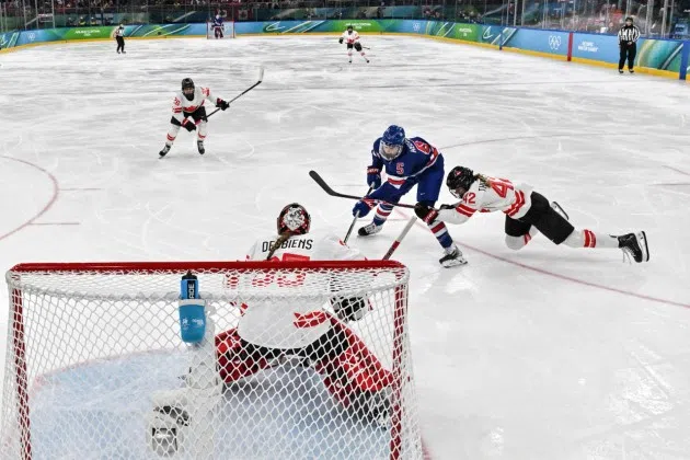 United States' Megan Keller (5) scores the winning goal during the women's ice hockey gold medal game between the United States and Canada at the 2026 Winter Olympics, in Milan, Italy, Thursday, Feb. 19, 2026.