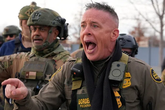 U.S. Border Patrol Cmdr. Gregory Bovino shouts at protesters, Sunday, Jan. 11, 2026, in Minneapolis.