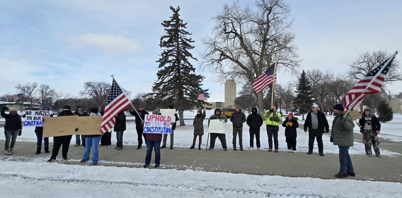 Small group protests Trump, Musk outside North Dakota Capitol during ...